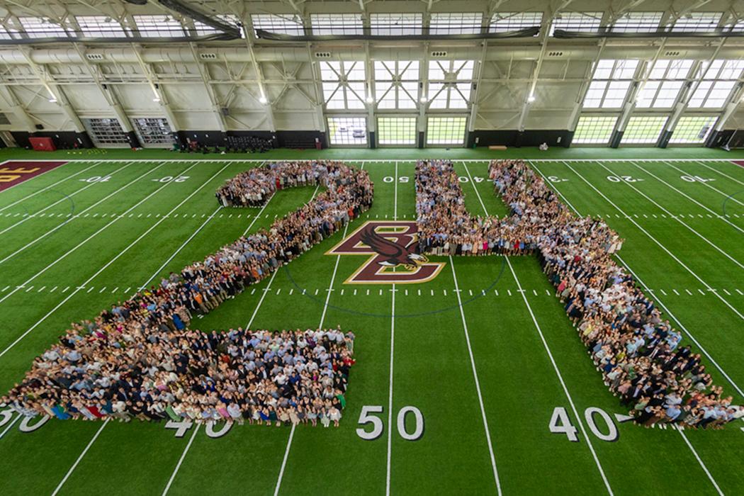Members of the senior class pose in the shape of the number 24