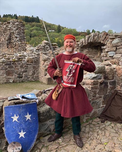 A Celtic warrior holding a BC banner