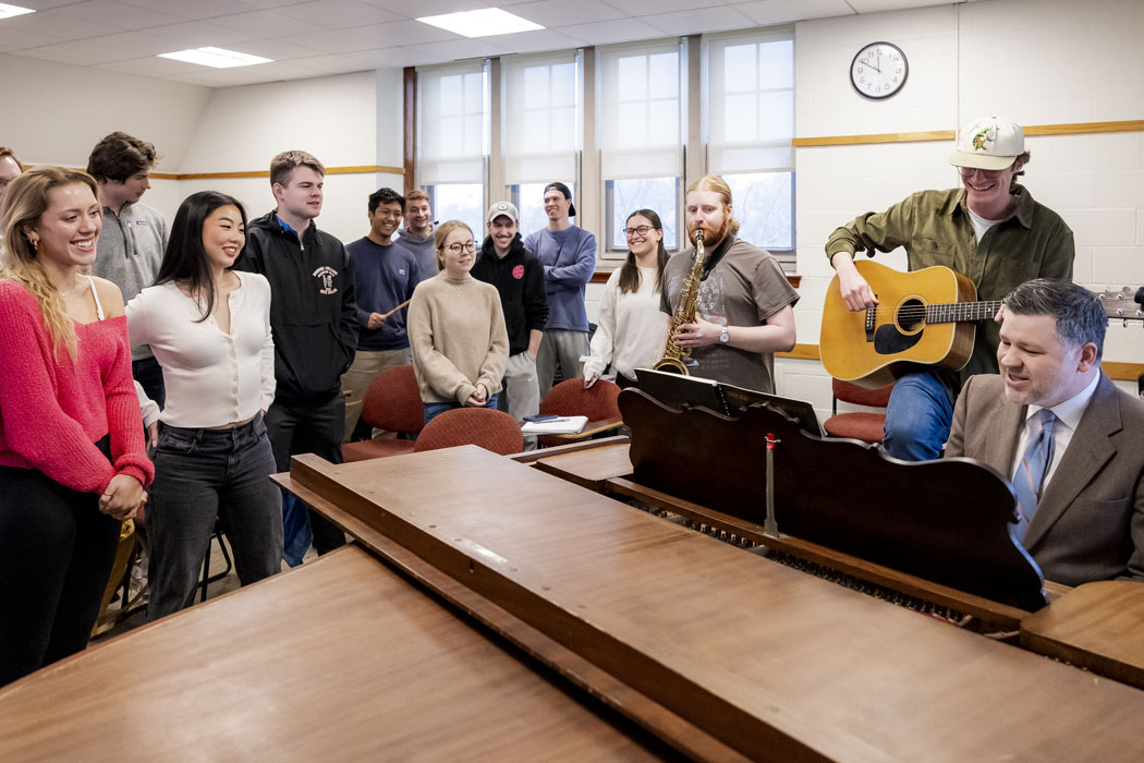 March 24, 2025 -- Boston College Morrissey College of Arts and Sciences faculty member Jason McCool teaching his Beatles seminar to undergraduate students in Lyons Hall.
IDs:
Sax: Jamie Gilson
Guitar: Cormac Delaney
BC Companions student: Kip Doran