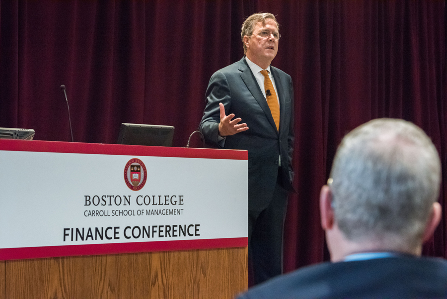 Jeb Bush speaking at a podium with the BC Finance Conference logo on it